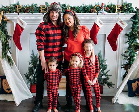 A picture of Nick and Vanessa with their children.